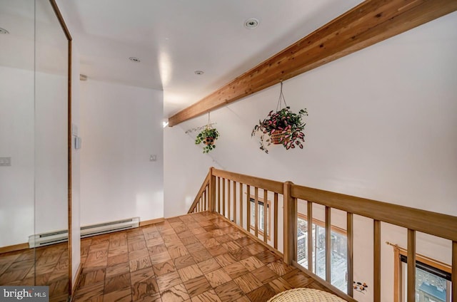 corridor with light parquet floors, beamed ceiling, and a baseboard heating unit