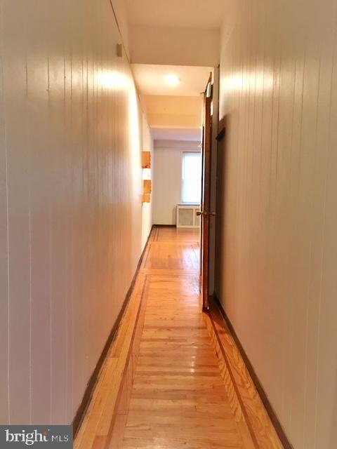 hallway with light wood-type flooring