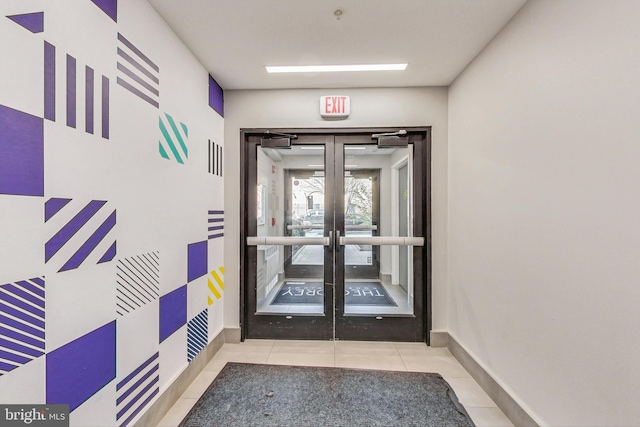 interior space with french doors and tile flooring