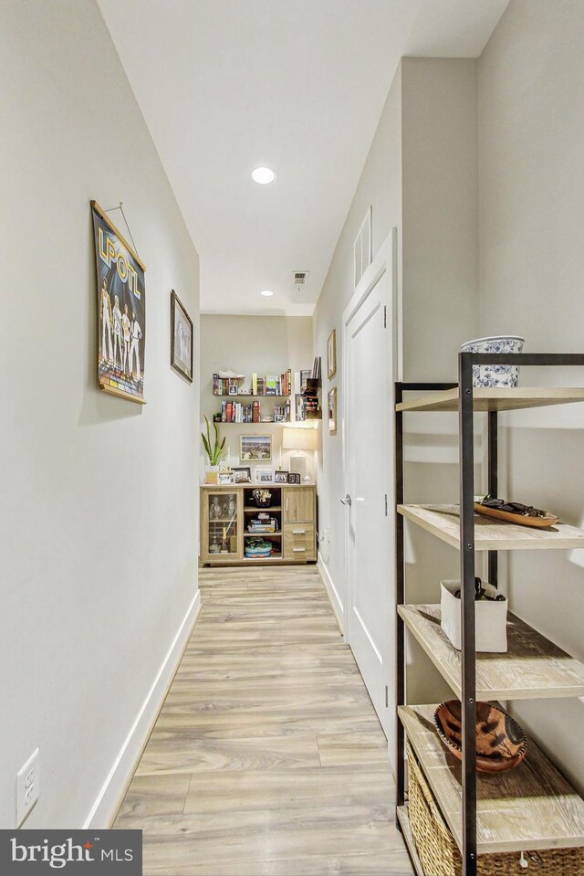 corridor featuring light hardwood / wood-style floors