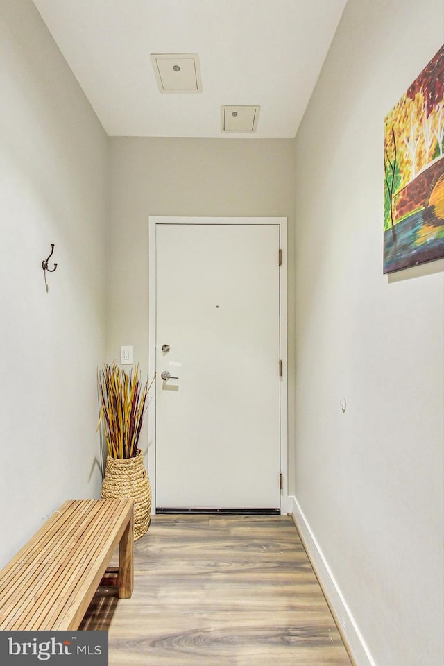 doorway to outside with hardwood / wood-style floors