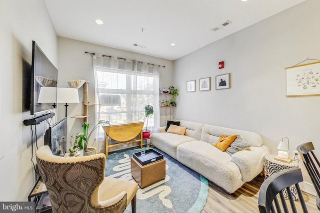 living room with light hardwood / wood-style floors