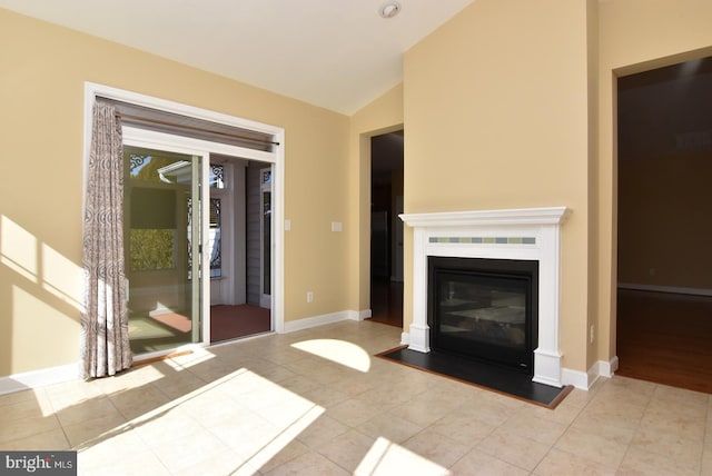 unfurnished living room with lofted ceiling and light hardwood / wood-style flooring