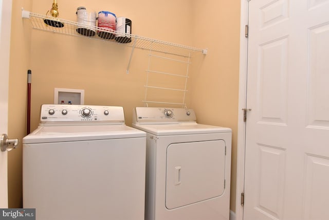 laundry area with independent washer and dryer and hookup for a washing machine