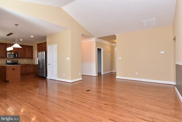 unfurnished living room featuring lofted ceiling, crown molding, and light hardwood / wood-style flooring