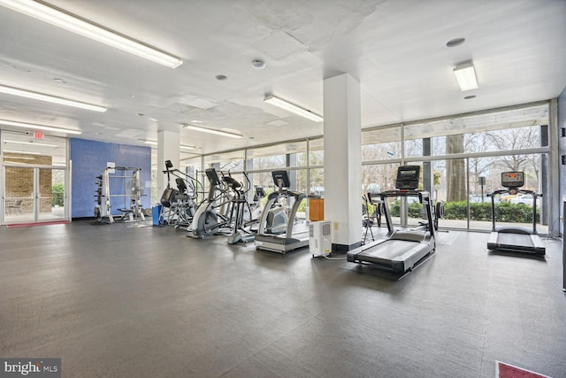 gym with a wall of windows