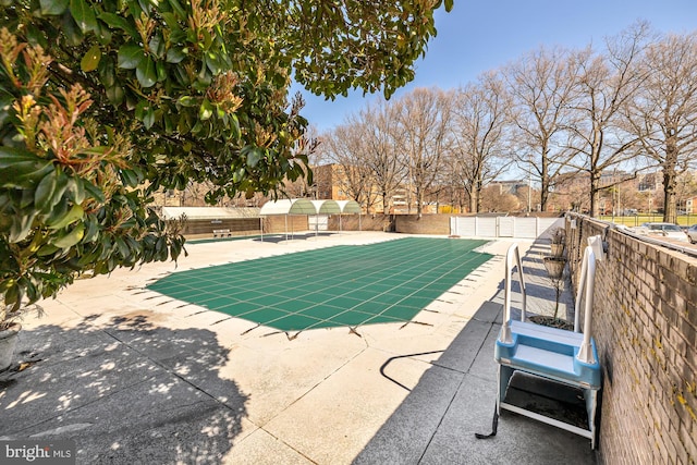 view of swimming pool featuring a patio area