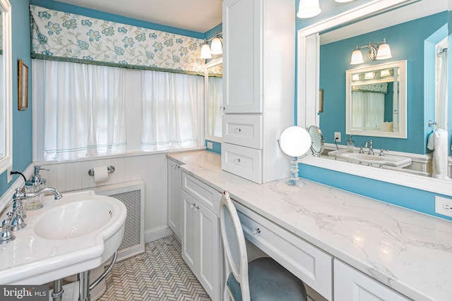 bathroom with vanity and tile flooring