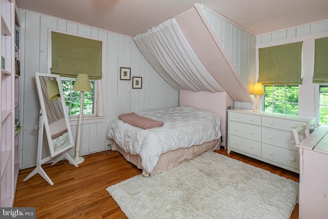 bedroom with hardwood / wood-style floors