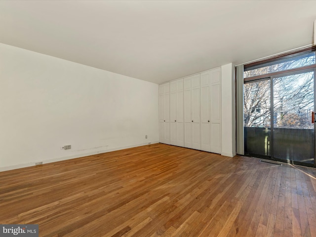 unfurnished bedroom featuring hardwood / wood-style floors