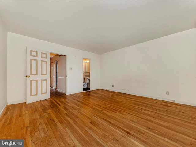 unfurnished room featuring light hardwood / wood-style flooring