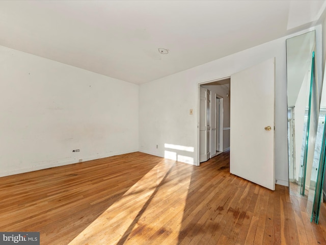 empty room featuring hardwood / wood-style flooring