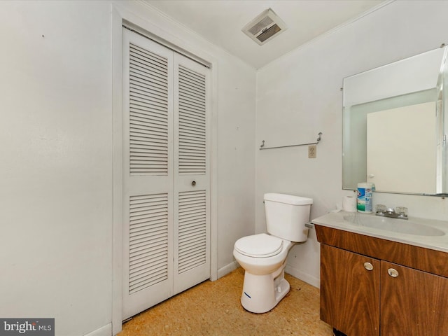 bathroom featuring vanity and toilet