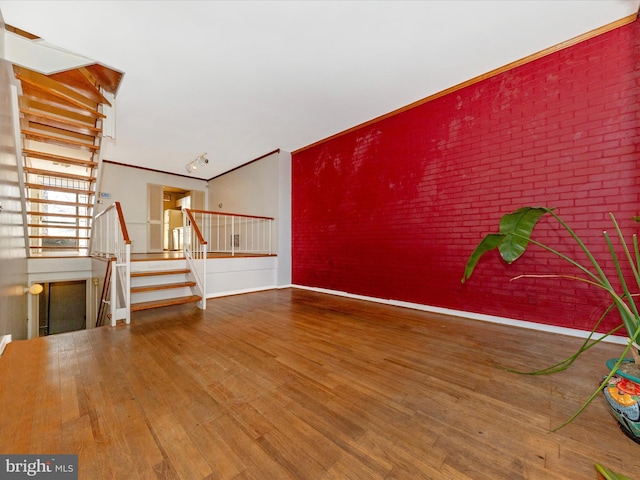 unfurnished living room featuring wood-type flooring