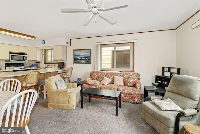 carpeted living room featuring plenty of natural light, ceiling fan, and crown molding