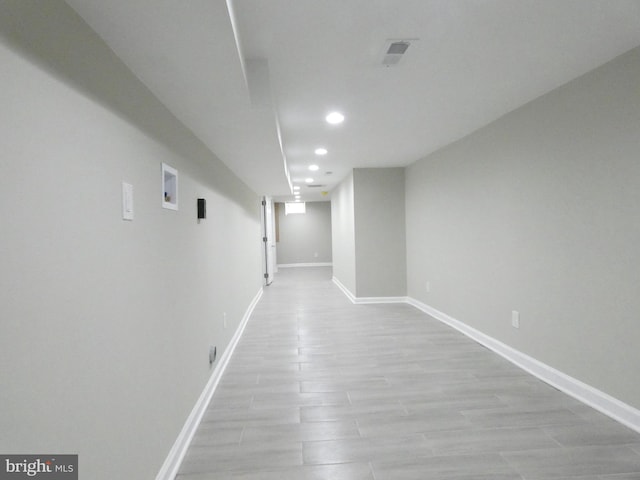 hall with light hardwood / wood-style flooring