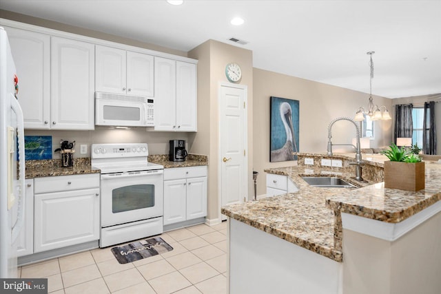 kitchen featuring a notable chandelier, white appliances, decorative light fixtures, sink, and white cabinets