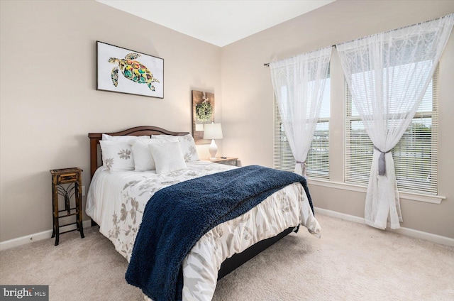 bedroom with light colored carpet