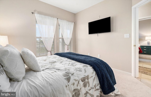 bedroom featuring light tile floors