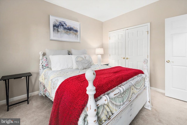 carpeted bedroom featuring a closet