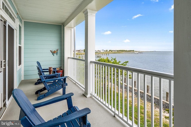 balcony featuring a water view