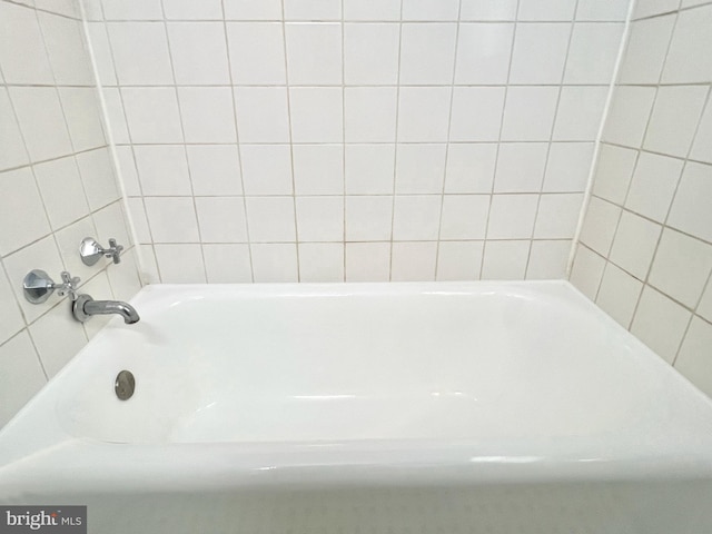 bathroom featuring a tub to relax in