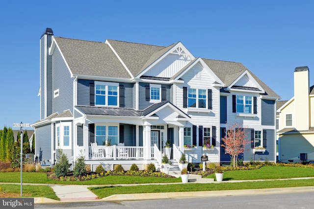 view of front of home featuring a porch and a front yard