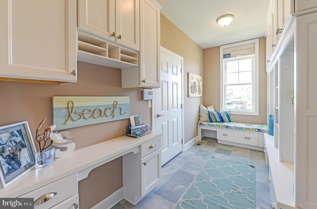 mudroom featuring light tile floors