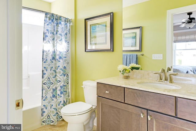 full bathroom featuring toilet, ceiling fan, vanity, shower / bath combination with curtain, and tile floors