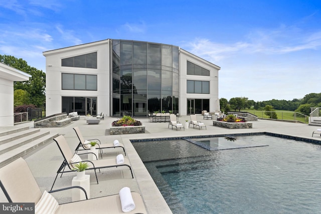 view of pool featuring a patio area and an outdoor living space