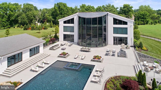 view of pool featuring a lawn and a patio