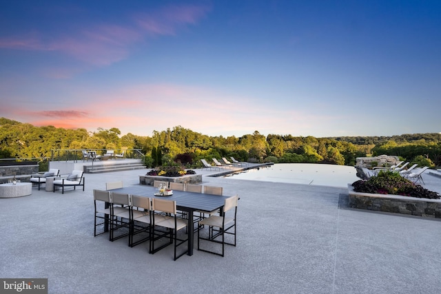 view of patio terrace at dusk