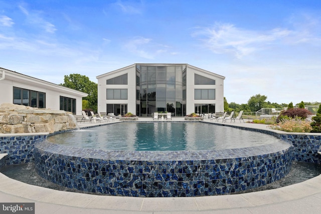 view of pool featuring a patio