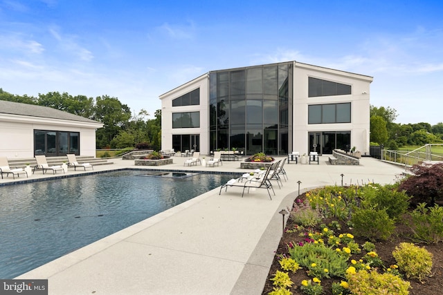 view of swimming pool with a patio area