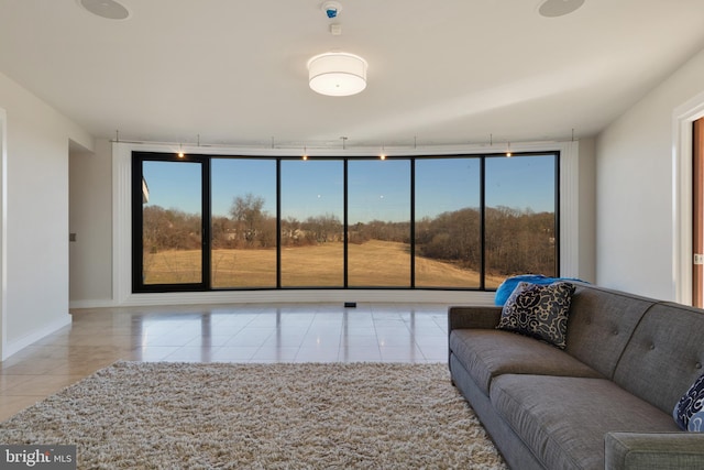 tiled living room with a wealth of natural light