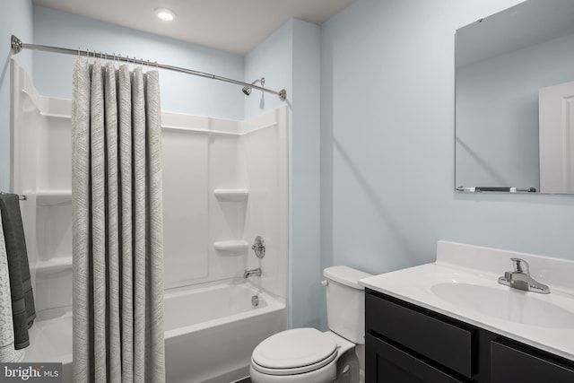 full bathroom featuring vanity, toilet, and shower / bath combo with shower curtain