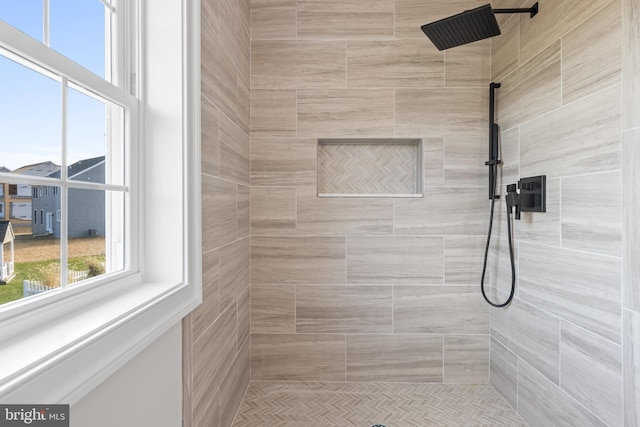 bathroom with a tile shower