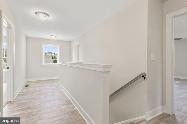 hall with light hardwood / wood-style flooring