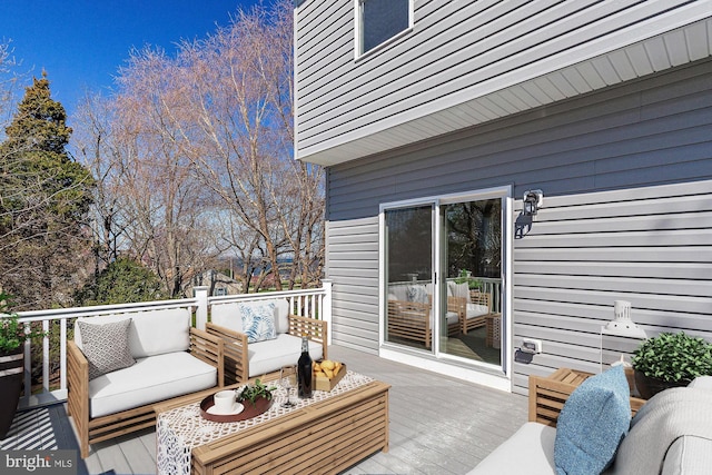 wooden terrace featuring an outdoor hangout area