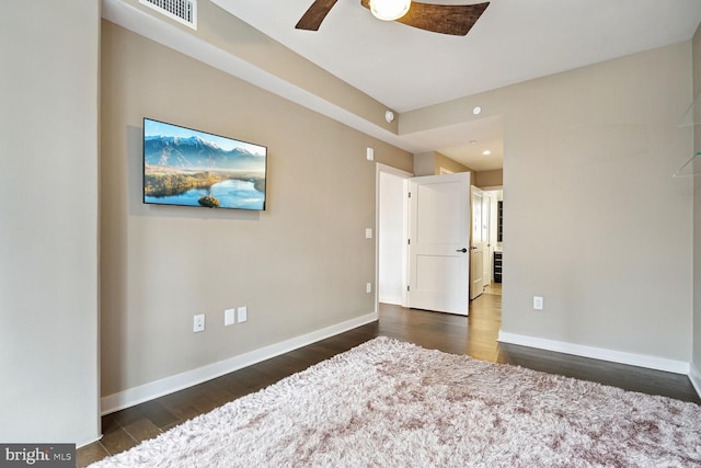 bedroom with ceiling fan and dark wood-type flooring