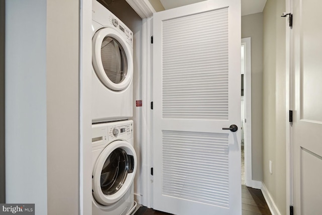 washroom featuring stacked washer and dryer