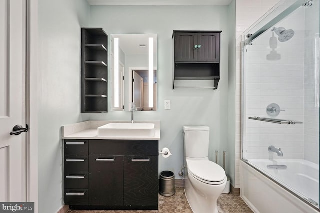 full bathroom featuring vanity, toilet, tile patterned floors, and enclosed tub / shower combo