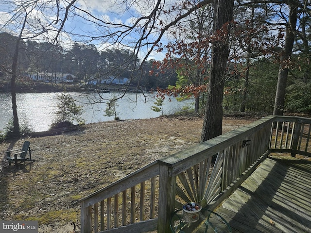 wooden terrace with a water view