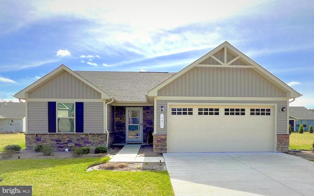 craftsman-style home with a front yard and a garage