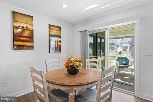 dining area featuring dark hardwood / wood-style floors