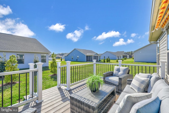 wooden deck with an outdoor hangout area and a lawn