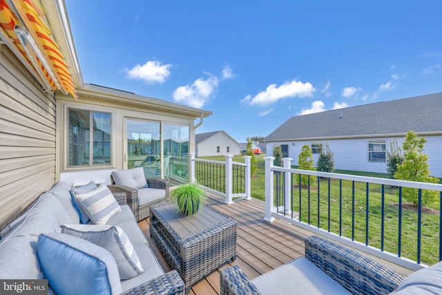 wooden deck featuring a lawn and an outdoor living space