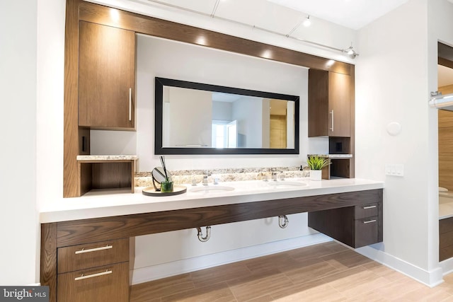 bathroom featuring dual sinks and oversized vanity