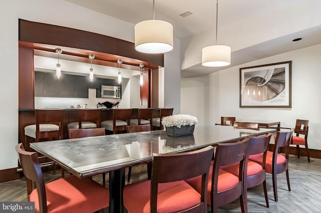 dining area featuring light parquet floors