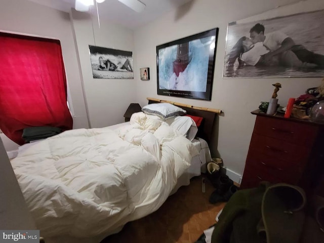 bedroom featuring hardwood / wood-style floors and ceiling fan